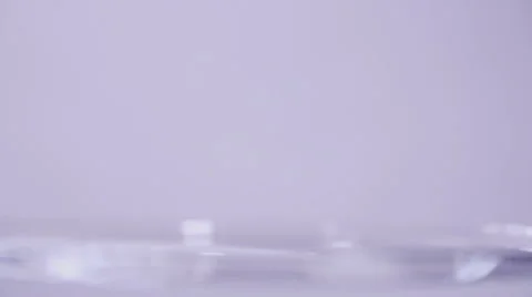 Throwing a small rock into water slow motion Stock Footage 58761374