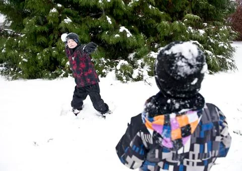 Throwing snow ball Stock Photos