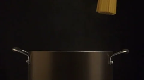 Throwing the spagetti into the cooking pot Stock Footage 61827179