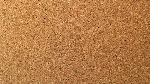 Throwing stickers into a cork board in a bunch. The view is right on the note Stock Footage 202139813