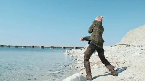 Throwing stones on water Stock Footage 295321737