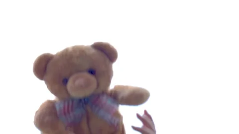 Throwing a teddy bear up Stock Footage 136065056
