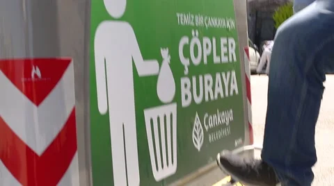 Throwing Trash In Garbage. Garbage Container Stock Footage 65478354