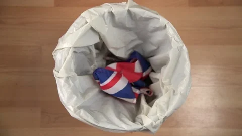 Throwing Union Jack in Bin Stock Footage 157174278