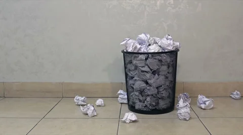 Throwing useless paper into the full waste basket in office Stock Footage 62493507