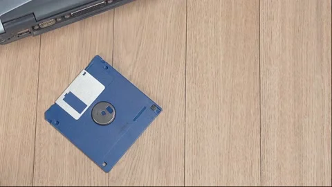 Throwing vintage 3.5 floppy discs into a pile. Obsolete computer technology. Stock Footage 149423562