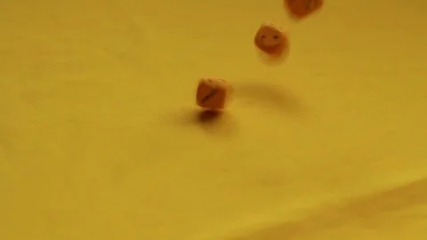 Throwing yellow dice, four and one Stock Footage 89322256