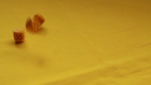 Throwing yellow dice, one and two Stock Footage 89322075