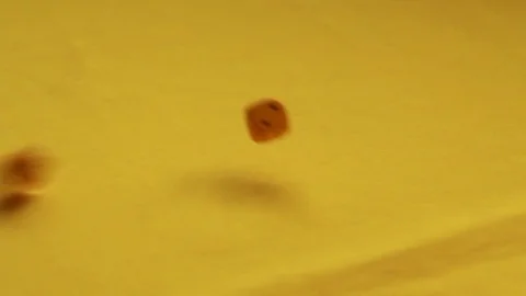 Throwing yellow dice, three Stock Footage 89322154