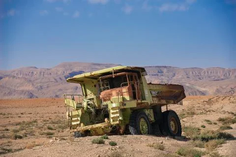 .thrown a dump in the desert of tunisia on the background of the mountains Stock Photos