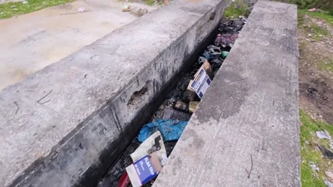 Thrown Garbage and Waste Show the Impact of Pollution on Nature 스톡 동영상 305234832