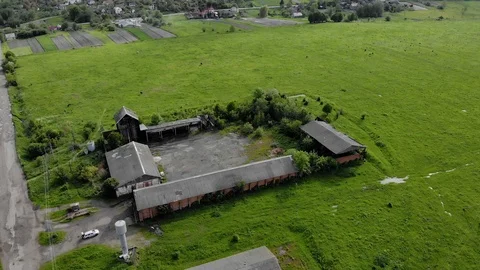 Thrown hangars, with an old metal tower water reservoirs aerial background Stock Footage 108433700