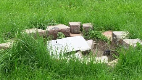 Thrown office printer copier breaking into pieces in circle of bricks 動画素材 276340293