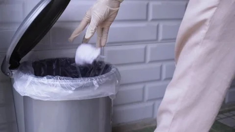 Throws garbage into the trash can Stock Footage 274469123