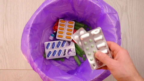 Throws medicine pills into the trash. Generative AI, Stock Footage 233998267