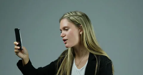 Throws phone due to poor video call connection Stock Footage 267585865