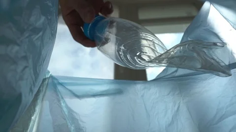 Throws plastic in the trash. View from the trash can Video stock 109575271