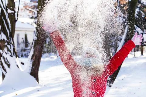 Throws snow up.child in the winter Stock Photos