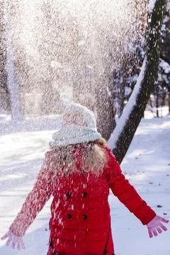Throws snow up.child in the winter Stock Photos