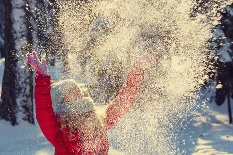 Throws snow up.child in the winter Stock Photos