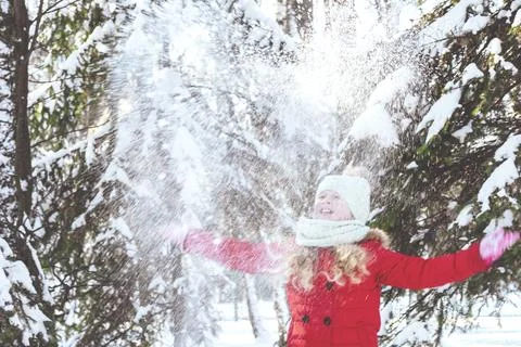 Throws snow up.child in the winter Stock Photos