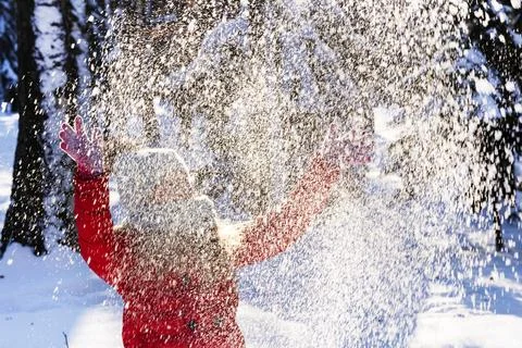 Throws snow up.child in the winter Stock Photos