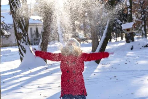 Throws snow up.child in the winter Stock Photos