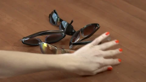 Throws off the table off Sunglasses. Stock Footage 105640404