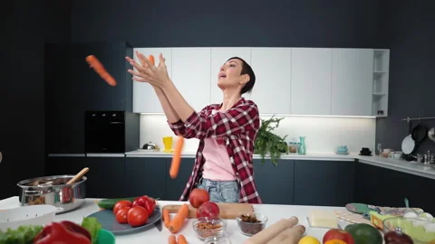 Throws up washed carrots trying to juggle and does not catch any charming short Stock Footage 147602261