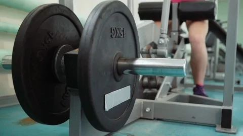 Thrust of the upper block. The girl is doing exercises on the simulator in the Video stock 82964299