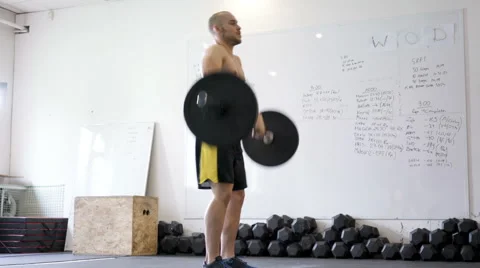 Thruster exercise - young athlete doing weight lifting workout at gym Stock Footage 65280116