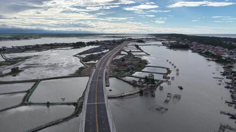 Thuan An Bridge at eye level aerial with town below 4K Stock Footage 339860850