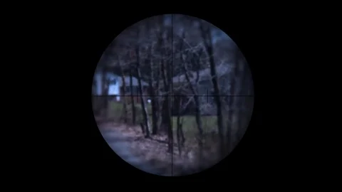 Thug or henchmen is gunned down through a sniper scope V2 Stock Footage 73944193
