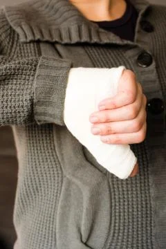 Thumb down by bandaged hand Stock Photos