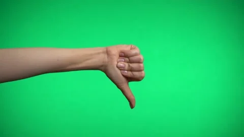 Thumb down on a green background. Video stock 163600111