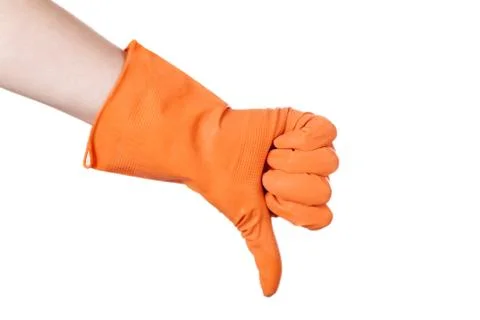 Thumb down in the orange vinyl gloves Stock Photos