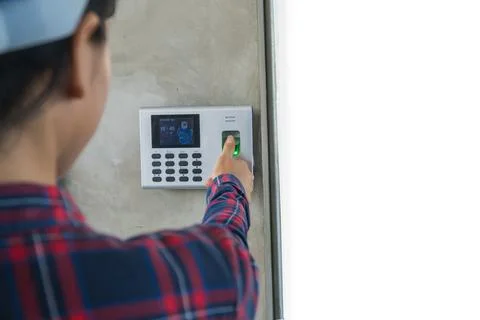 Thumb on the fingerprint scanner to work. Stock Photos