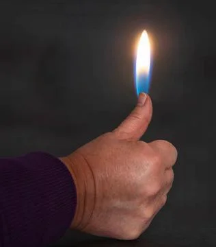 Thumb on Fire Stock Photos