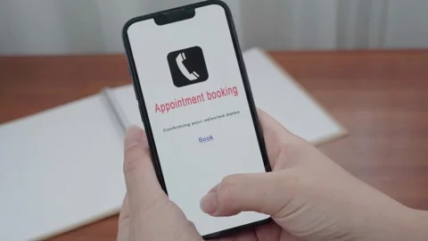 Thumb Hovering Over Appointment Booking Confirmation on Smartphone Stock Footage 340965435
