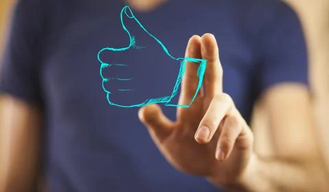 Thumb up on man hand Stock Photos