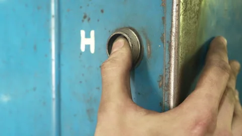 The thumb of a man's hand presses the button and holds it Stock Footage 274473846