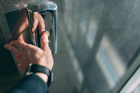 The thumb presses the Elevator button, a hand reaching for the button, the gi Foto stock
