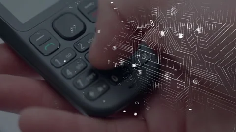 Thumb pressing 405 code on phone keypad dissolving digits into circuit overlay 스톡 동영상 309872361