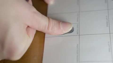 Thumb print on document side view Stock Footage 249290469