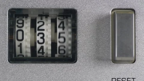 Thumb push reset Button from mechanical counter Stock Footage 329674292