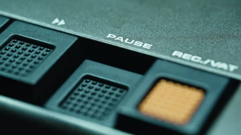 Thumb pushing pause key on deck machine interacting with audio control closeup Stock Footage 332364467