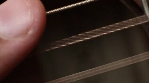 Thumb sequentially strikes three strings on the guitar Video stock 32226415