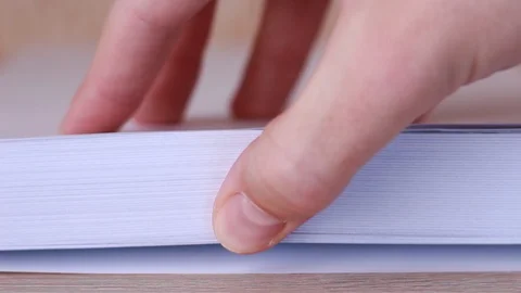 Thumbing through blank sheets closeup Stock Footage 86231322
