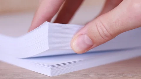 Thumbing through blank sheets of paper Vídeo Stock 86231173