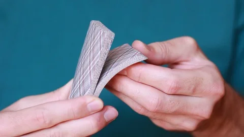 Thumbing through card deck closeup 動画素材 93336552